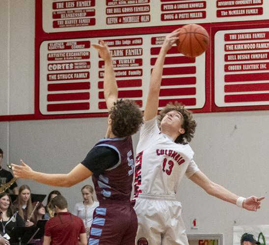 Caleb Reynolds (13) jumps for the ball in front of a home crowd.