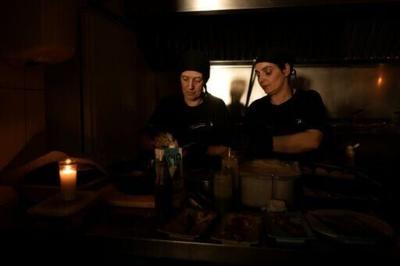A restaurant operating without lights in Ronda, near the Spanish city of Malaga during a massive power cut that hit the Iberian Peninsula in April