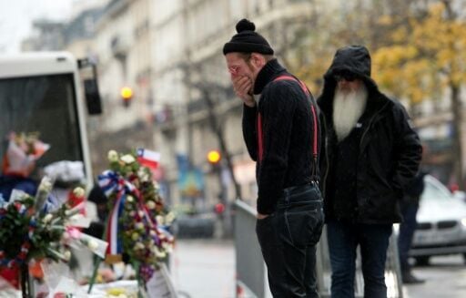 Eagles of Death Metal singer Jesse Hughes, left, and guitarist Dave Catching pay tribute to the Bataclan victims in 2015
