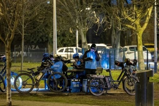 Filling a gap: a group of foreign delivery riders waiting for work in central Zagreb