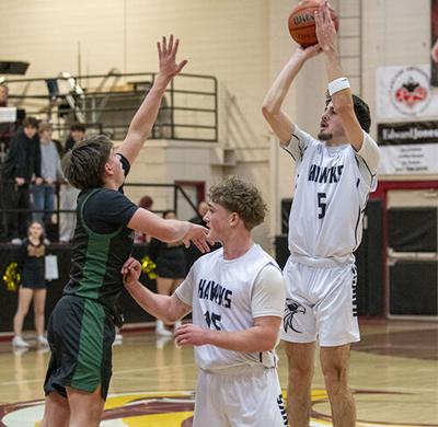 Bryson Cates (15) sets a screen for a Calder Morrison (5) three pointer against North Marion.