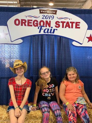 A3 State Fair Rylee Keyle Emmi on a bale.jpg
