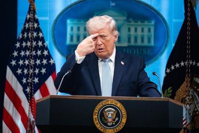 President Donald Trump mimics an Iranian protester being shot while holding a news conference in the White House on April 6, 2026.