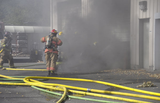 Fire destroys limousine, damages second vehicle