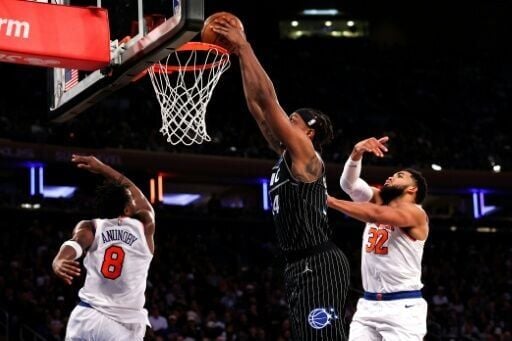 Wendell Carter Jr. of the Orlando Magic dunks the ball against OG Anunoby and Karl-Anthony Towns in the Magic's NBA win over the New York Knicks
