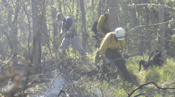 Scrambling to wildfires; Dual blazes test region’s resources