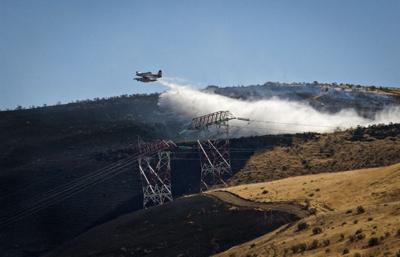 Fire burns in Heritage Park at mouth of Deschutes River