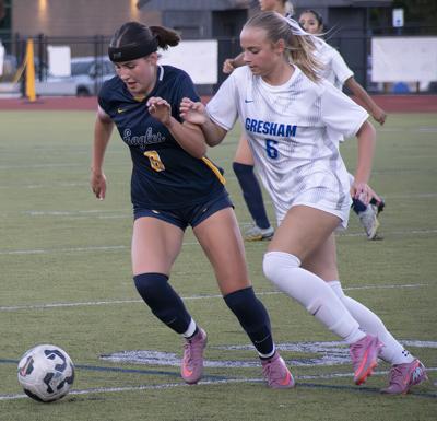 Hazel Haspela (8) dribbles the ball for Hood River Valley girls soccer during a prior match against Gresham.  Zach Thummel photo