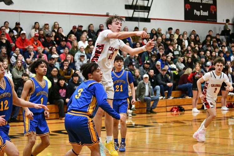 Caleb Reynolds (13) passes the ball out of the paint against Rochester on Feb. 10.