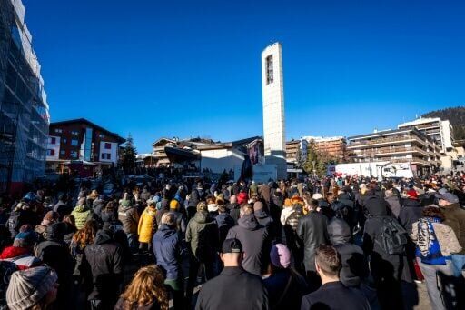 Mourners filled the square outside the chapel to follow the mass dedicated to the victims of the deadly fire up the street at Le Constellation bar