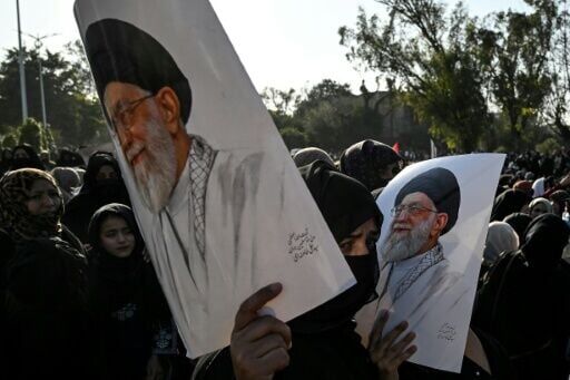 Shiite Muslims hold portraits of Iran's late supreme leader Ayatollah Ali Khamenei as they protest at the US embassy in Islamabad on March 1, 2026
