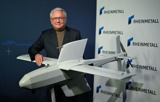 Rheinmetall CEO Armin Papperger with one of the company's strike drones