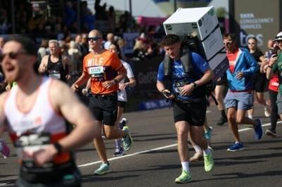 Jordan Adams carrying a fridge starts the 2026 London Marathon