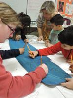 Creating for Camp Koru: Odell students’ kiteboard artwork auctioned at K4C this weekend