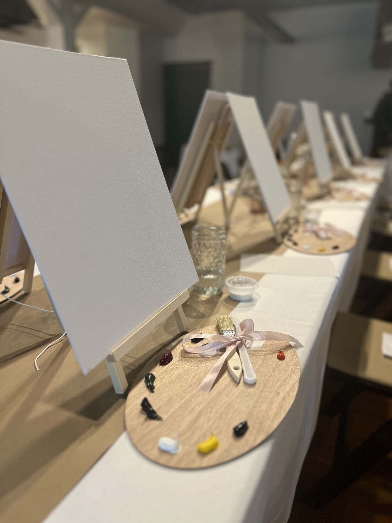 Event staff staged the room with each participants' art supplies for the evening. Photo courtesy of Rachel Rand.