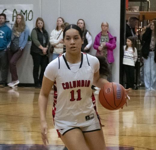 Joella Posini (11) drives toward the basket during a game at Columbia High earlier this year.