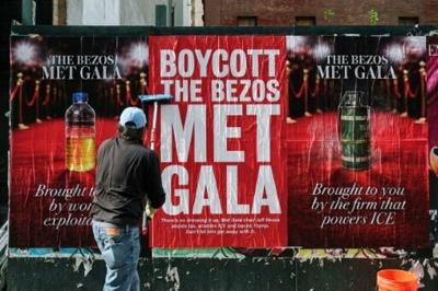 Activists have deployed posters to oppose Jeff Bezos's involvement in the Met Gala