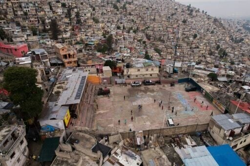 Children playing football in a mini-stadium in the Jalousie neighborhood of Port-au-Prince