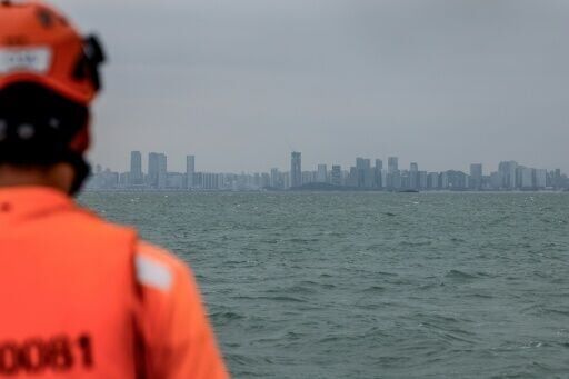 Across a narrow strip of water, the skyline of the Chinese city of Xiamen can be seen from Taiwan