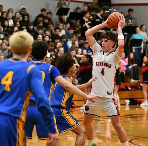 Hunter Wang (4) handles the ball at the top of the key for the Bruins against Rochester on Feb. 10.