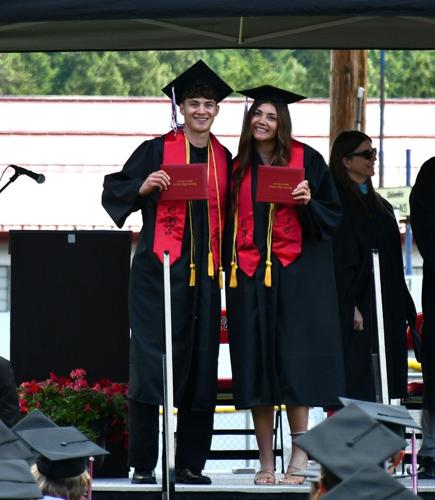 Matthew Miller (left) and Sara Miller (right) receive their diplomas from Columbia High School in White Salmon on Saturday, June 6.