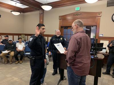Cristian Galvez takes his oath from Mayor Blackburn