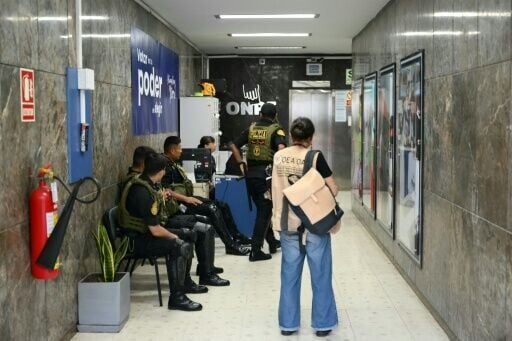 Members of Peru’s police force stand guard inside the National Office of Electoral Processes (ONPE) in Lima on April 12, 2026, during the general election.