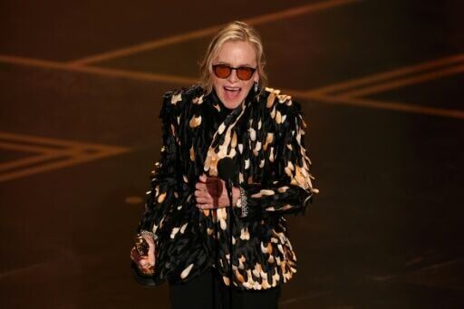 US actress Amy Madigan accepts her Oscar for best supporting actress for 'Weapons'