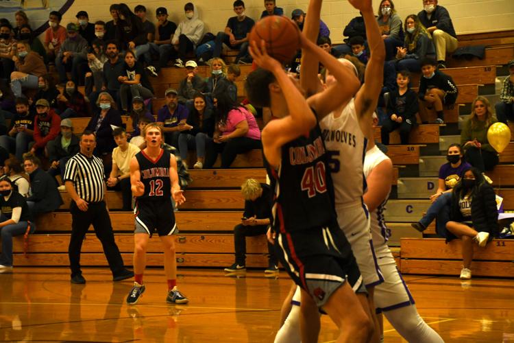 CHS#40 Porter Haskell driving towards hoop with Jace Greenwood#12 looking on.JPG