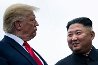 US President Donald Trump and North Korea's leader Kim Jong Un talk before a meeting in the demilitiarized zone near Panmunjom in 2019.