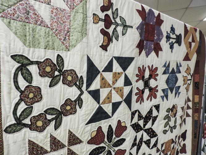 A11 textiles, Judith Poage's hand-applicated quilt earned a blue ribbon.JPG