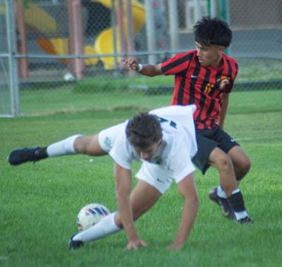 Julian Rodriguez (11) for The Dalles dribbles the ball earlier this year.  Martin Gibson photo