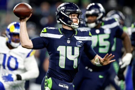 Sam Darnold's three touchdowns steered Seattle into the Super Bowl with victory over the Los Angeles Rams