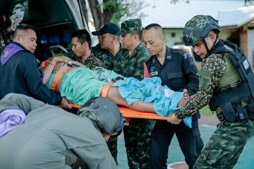 A wounded Thai soldier is evacuated following clashes along the Thailand-Cambodia border in Thailand's Sisaket province
