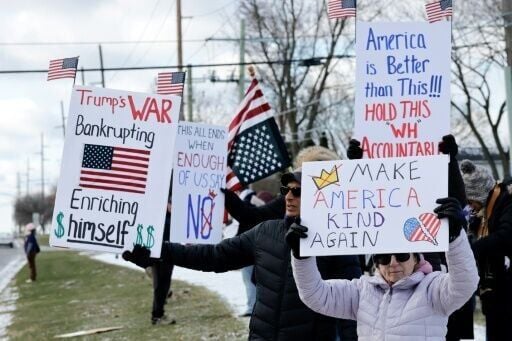 Demonstrators take part in the 'No Kings' national day of protest in West Bloomfield, Michigan, a suburb of Detroit