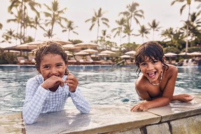 kids at the pool at four seasons resort Hualalai