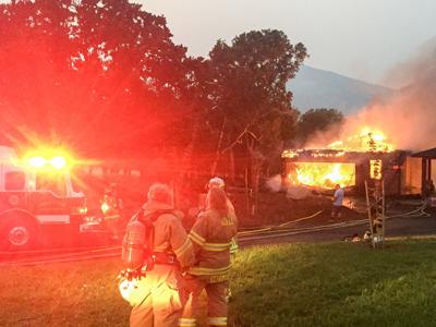 Tender care: firefighters knock down garage fire before it spreads to Post Canyon home