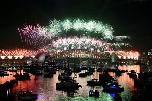 Sydney rang in the New Year with its customary fireworks display after pausing for a minute of silence to honour victims of the Bondi Beach mass shooting barely two weeks earlier