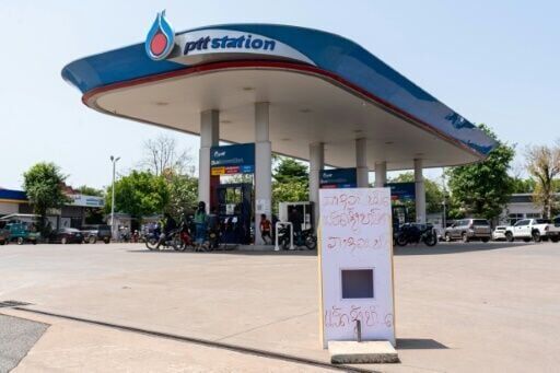 'Diesel run out and gasoline run out' reads a sign at a gas station in Vientiane in Laos on March 10, 2026