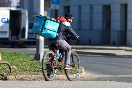 Vulnerable: a foreign delivery rider at work in downtown Zagreb