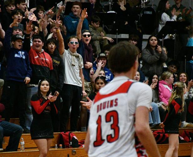 The Columbia High School (White Salmon) student section celebrates a made shot against Rochester on Feb. 10.
