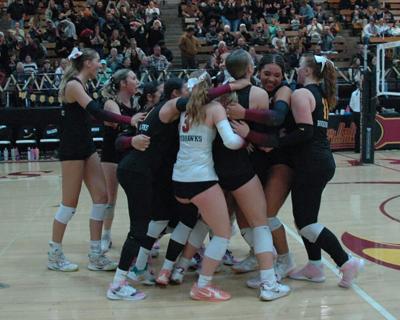 The Dalles volleyball players celebrate after a win earlier this year.  Mike Weber photo