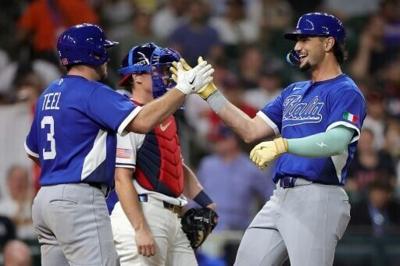 Kyle Teel (left) congratulates teammate Jac Caglianone after his solo home run in Italy's 8-6 upset over the United States