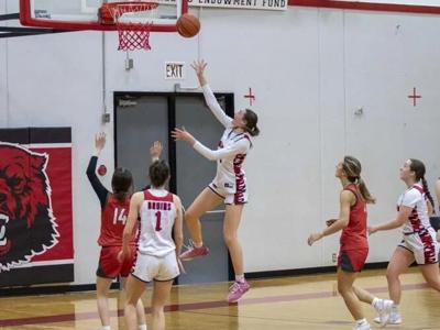 Sara Miller (4) scores a basket last year.  Columbia Gorge News file photo