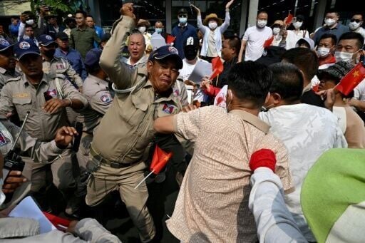 Chinese and Cambodian nationals believed to be Huione Pay creditors clash with police during a protest demanding their accounts be unfrozen, in Phnom Penh in April