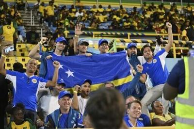 Curacao supporters celebrate their team's World Cup qualification after a draw with Jamaica