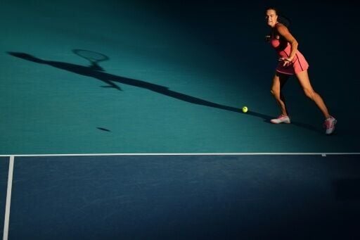 Aryna Sabalenka returns a shot en route to a straight sets defeat of China's Zheng Qinwen at the Miami Open