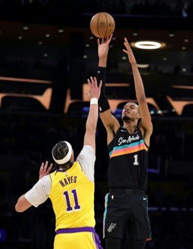 San Antonio star Victor Wembanyama puts up a shot over Jaxson Hayes in the Spurs' rout of the Los Angeles Lakers