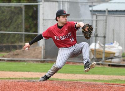 Evan Ortega (14) throws a pitch against Phoenix on March 24.
