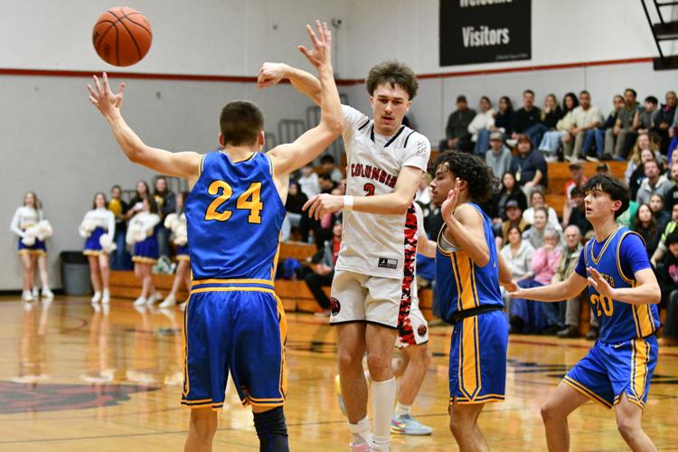 Levi Connell (2) dishes the ball to the perimeter against Rochester on Feb. 10